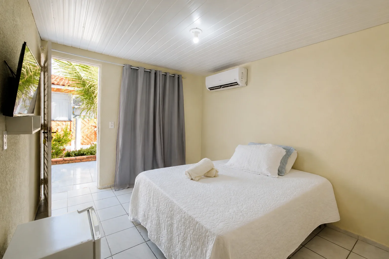 Quarto premium com ar-condicionado na Pousada Carlitus
